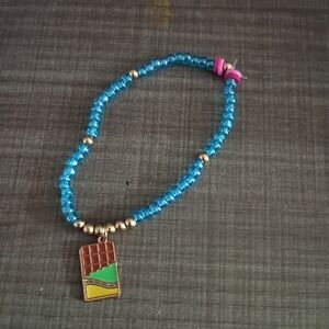 Blue Beaded Bracelet with Gold Accents and Pendant